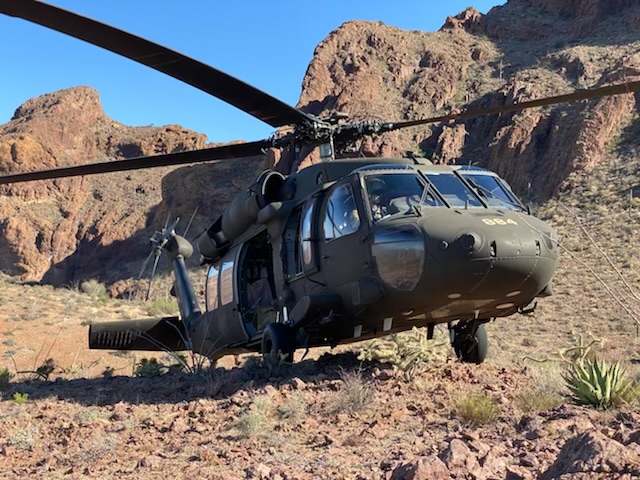 Army helicopter on desert terrain